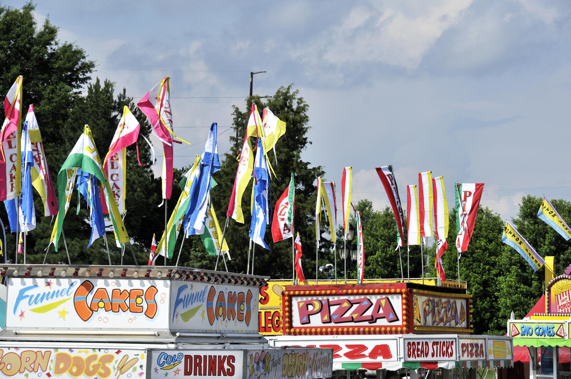 flags on top of fair vendors with food