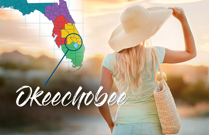 woman in okeechobee with straw hat and map of florida